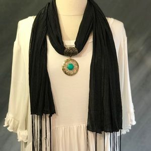 Black scarf with bronze medallion